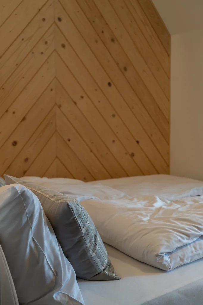 Wooden details by the bed