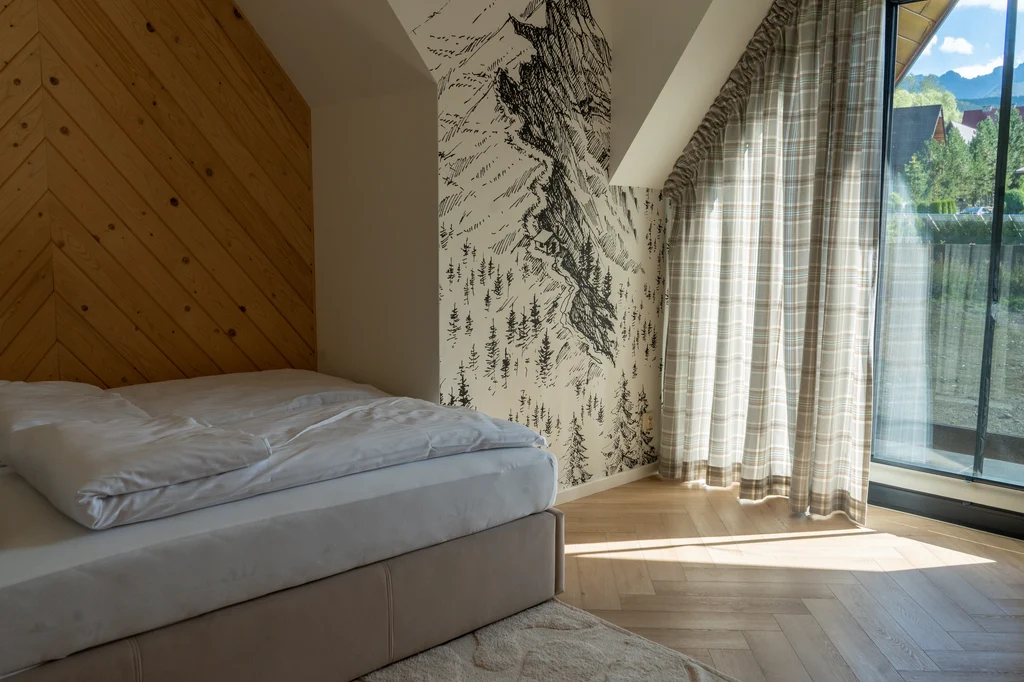 Bedroom with a mountain mural